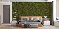 Green Embroidery Ferns Bracken wallpaper mural above a tan leather bed with grey bedding in a modern bedroom