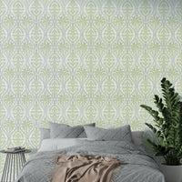 Textured green leaf damask wallpaper adding wall elegance

