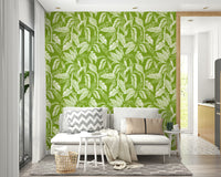 An angled shot of a wall with lush foliage wallpaper

