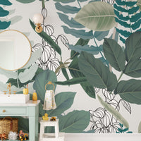 Abstract Green Leaves wallpaper mural styled as a feature wall behind a dining table and chairs in green tones