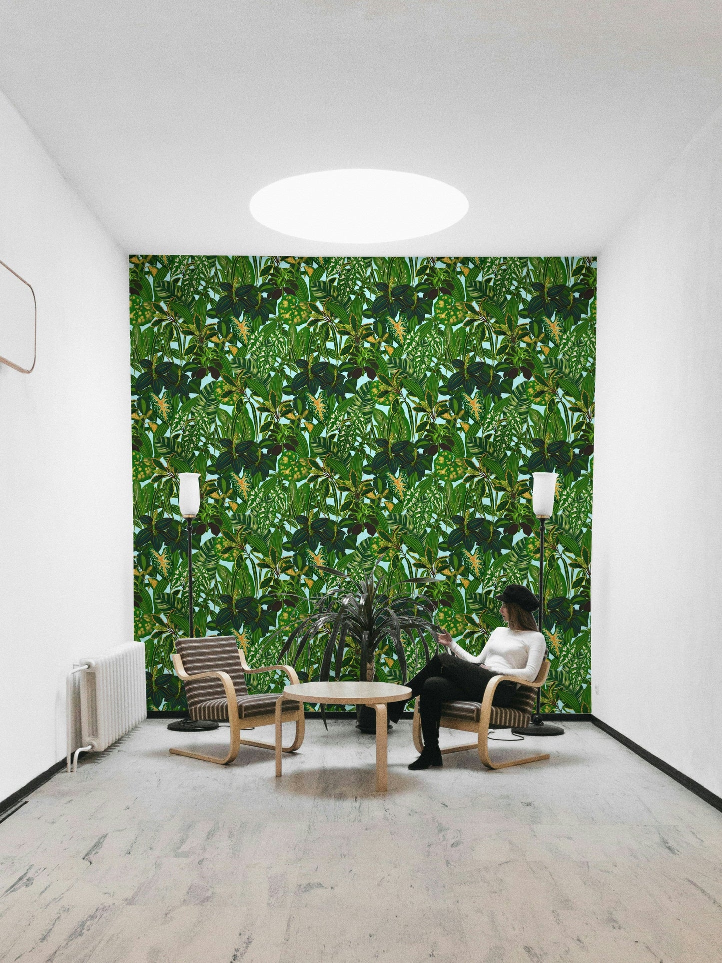 An angled shot of a wall with green wallpaper

