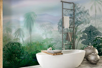 Green Tropical Rainforest wallpaper mural of palms behind a freestanding white bathtub and stone vases in a bathroom