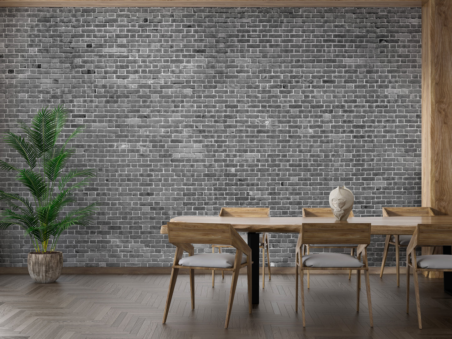 Grey brick mural behind a wooden dining table setup