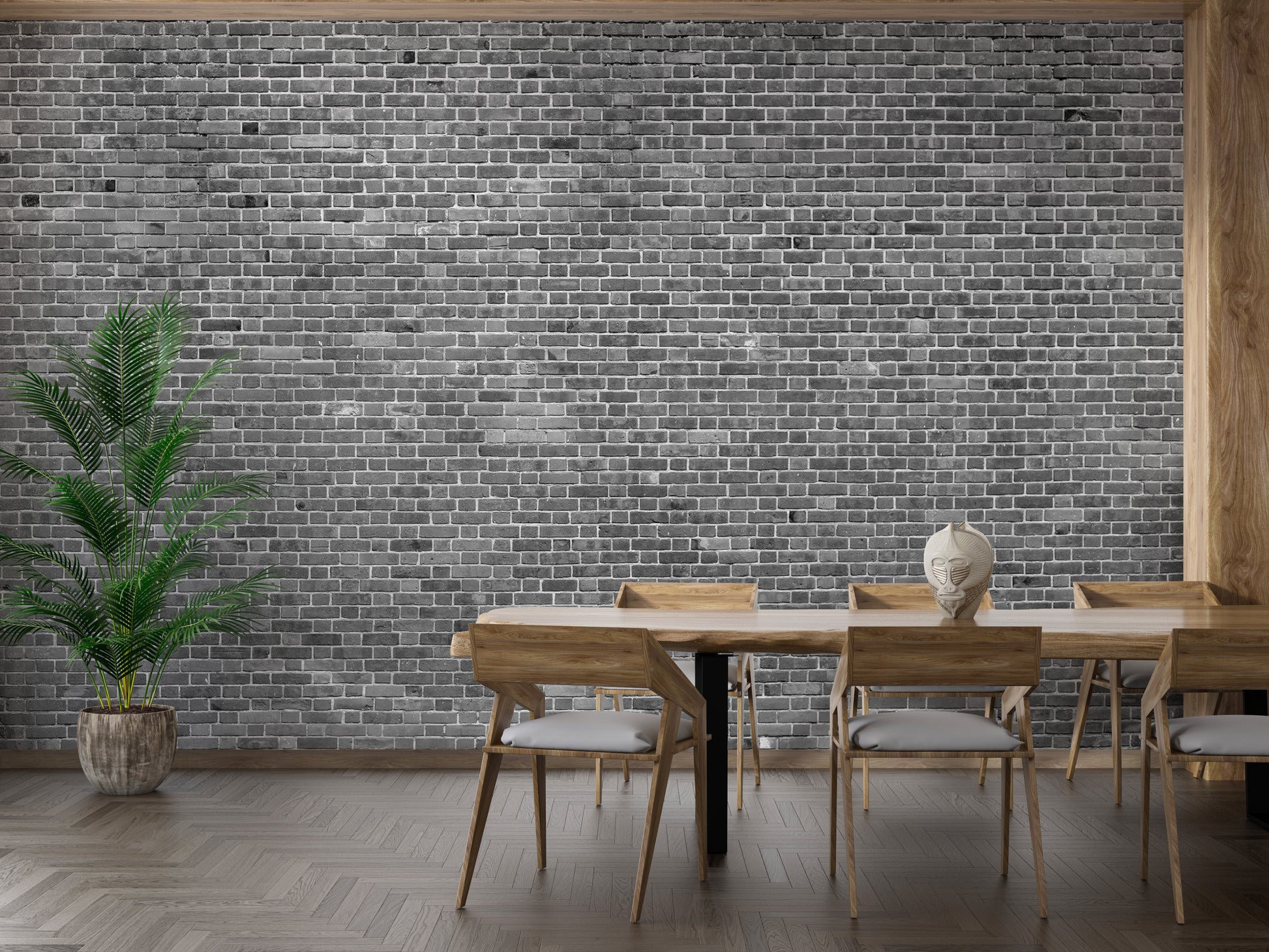 Grey brick mural behind a wooden dining table setup