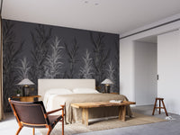 Grey Dracaena wallpaper mural styled as a feature wall behind a dining table and chairs in gray tones