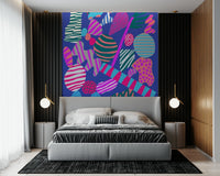 A lively wallpaper filled with colorful rounded and angular shapes in bright 80s-inspired patterns.