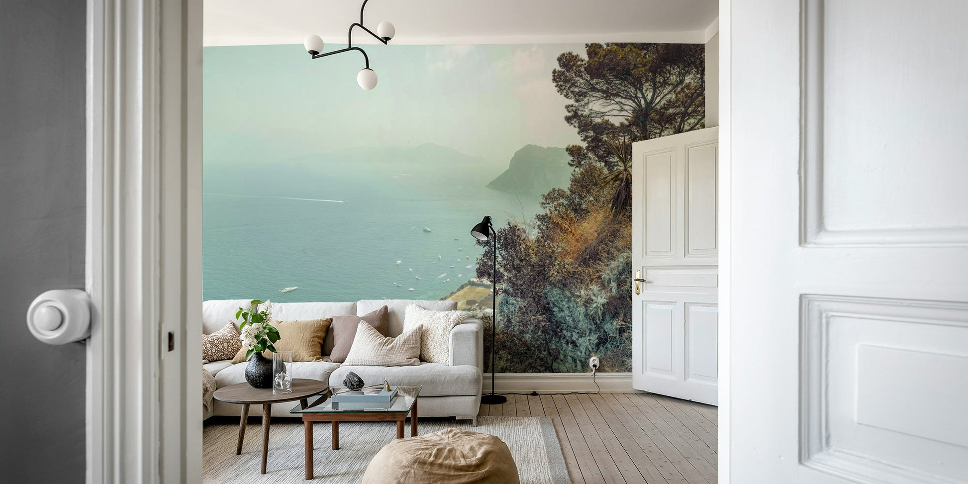 Lush green vegetation on foreground cliffs.

