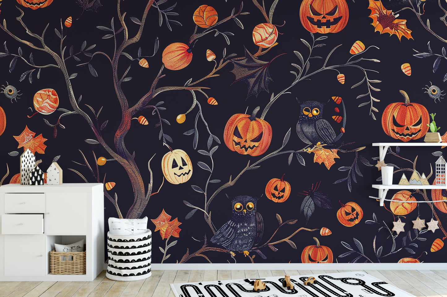 Temporary Halloween pumpkins owls wall mural in a nursery playroom with storage bins, perfect for a quick festive makeover.