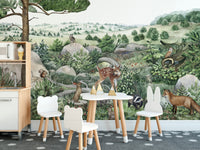 Happy Hills wallpaper mural of a fawn, fox and badger on rolling hills in a kids room with bear and bunny chairs