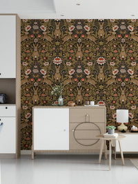 Hare & Bloom wallpaper in brown and gold behind a wood and white sideboard with a lamp in a bright hallway