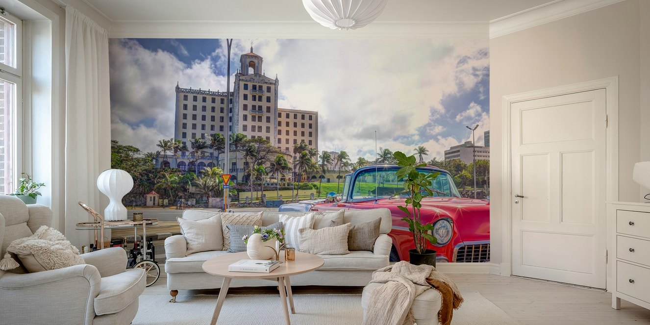 Wall mural of a Cuban street scene with a classic car.

