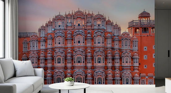 Hawa Mahal Walls wallpaper mural of the pink Jaipur palace facade beside a white sofa and round table