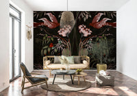 Heaven's Birds Joseon wallpaper mural of red birds and pink flowers behind a cane sofa and olive tree in a living room