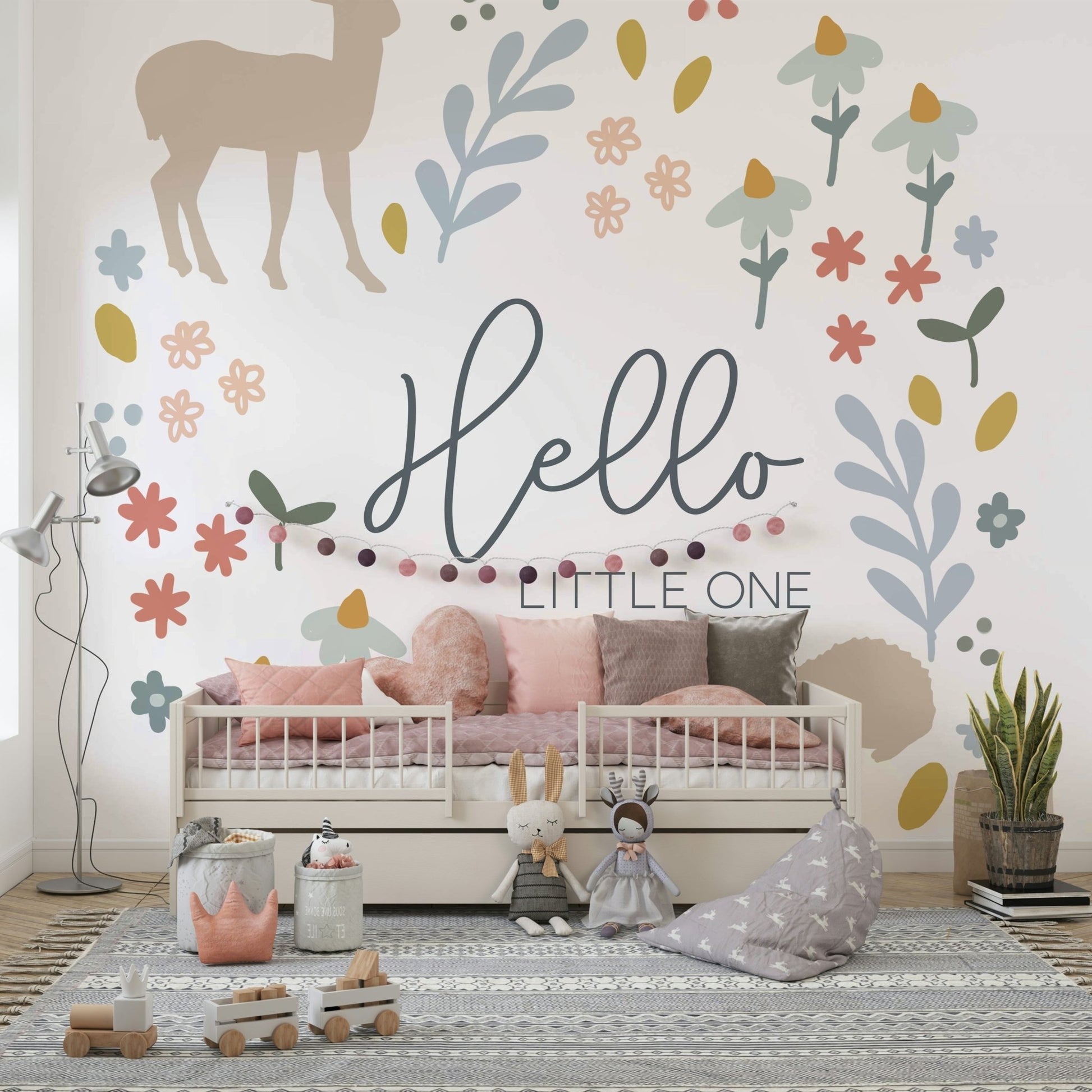 "Hello Little One" wall mural with gentle forest designs.

