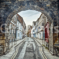 Through Time’s Arch wall art behind modern sofa in apartment