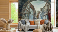 Neutral tone wall mural with ancient archway in cozy bedroom