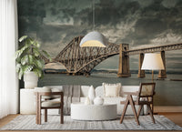 Historic Forth Rail Bridge wall mural behind a white sofa and monstera plant in a living room