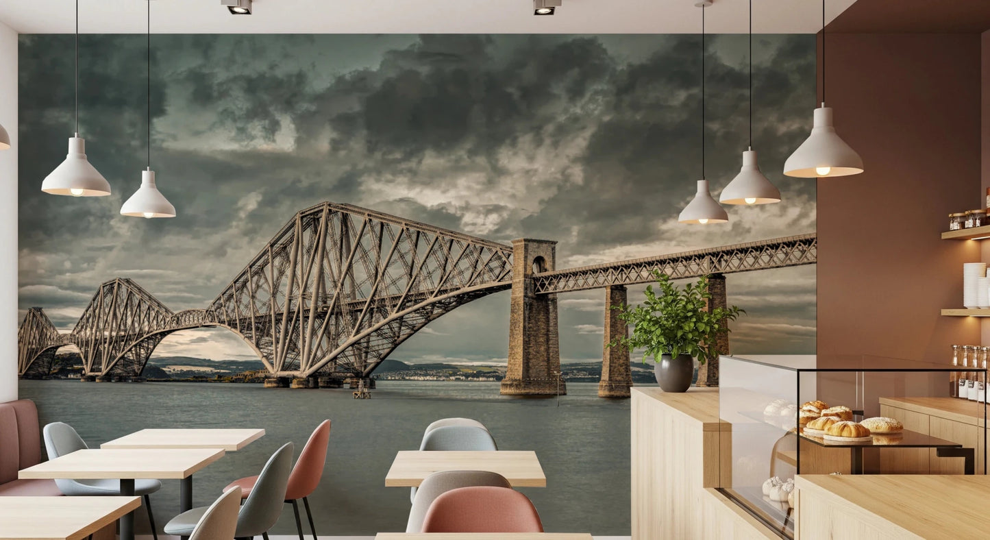Historic Forth Rail Bridge wall mural spanning a cafe wall above small tables and pastry counter