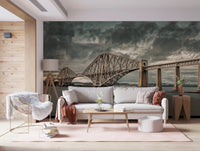 Historic Forth Rail Bridge wall mural over a grey sofa and white fur chair on a pink rug