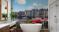 Honfleur Harbor Charm wallpaper mural of the harbor and red boat in a bathroom with a freestanding tub and marble vanity