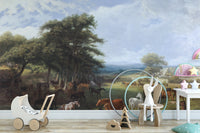 Horse Meadow wallpaper mural with horses by woodland trees behind a wooden bunny stool and toy pram in a nursery