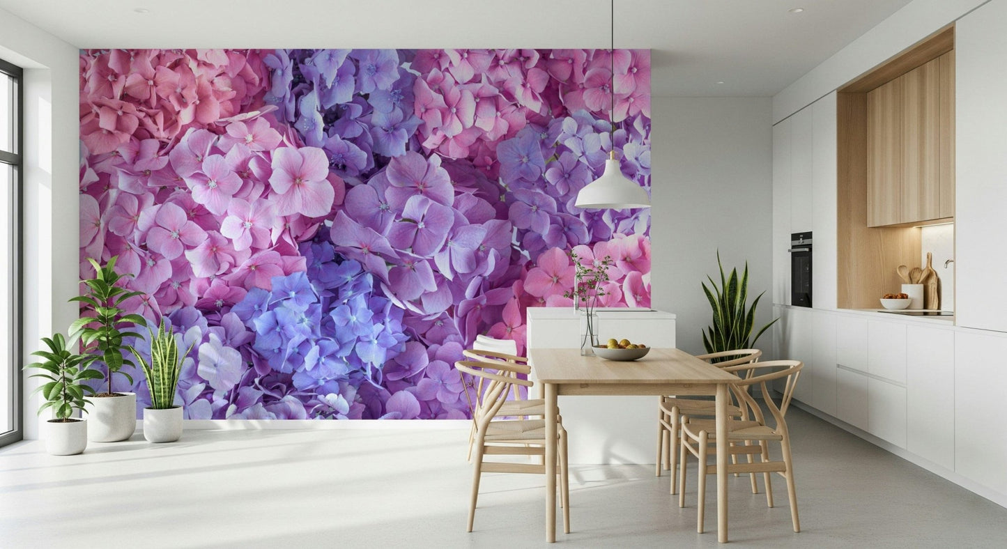 Hydrangea Hues wallpaper mural of bright hydrangeas in a white kitchen-dining room with a wood table and wishbone chairs