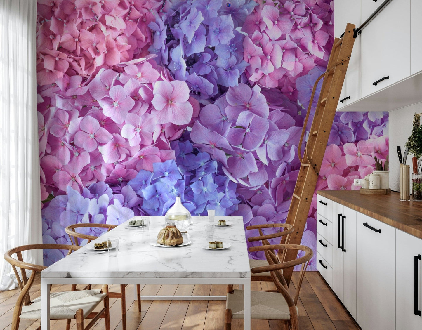Hydrangea Hues wallpaper mural of hydrangea flowers in a kitchen with a marble table, wishbone chairs and wood ladder