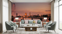 Iconic London at Dusk wall mural of the sunset skyline behind a cream sofa flanked by sage green armchairs