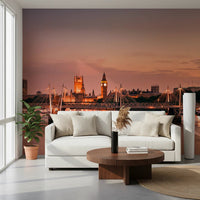 Iconic London at Dusk wall mural of Parliament at sunset behind a white sofa and round walnut table with a fiddle-leaf plant