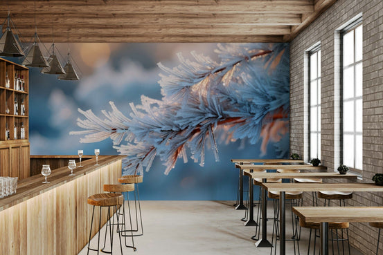 Icy Embrace wallpaper mural of a sunlit frosty pine branch on a wood bar wall with stools and brick in a cafe