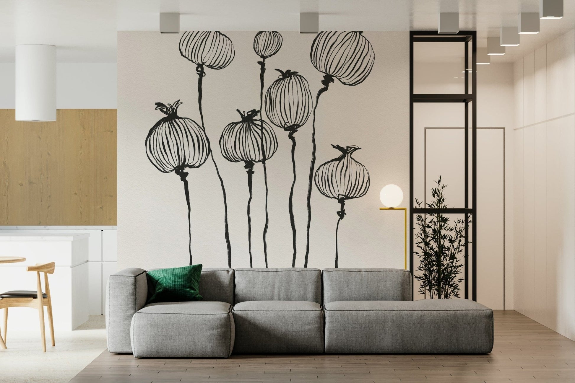 Ink Poppy Pods wallpaper mural of black sketched seed pods behind a gray low sofa with a green cushion