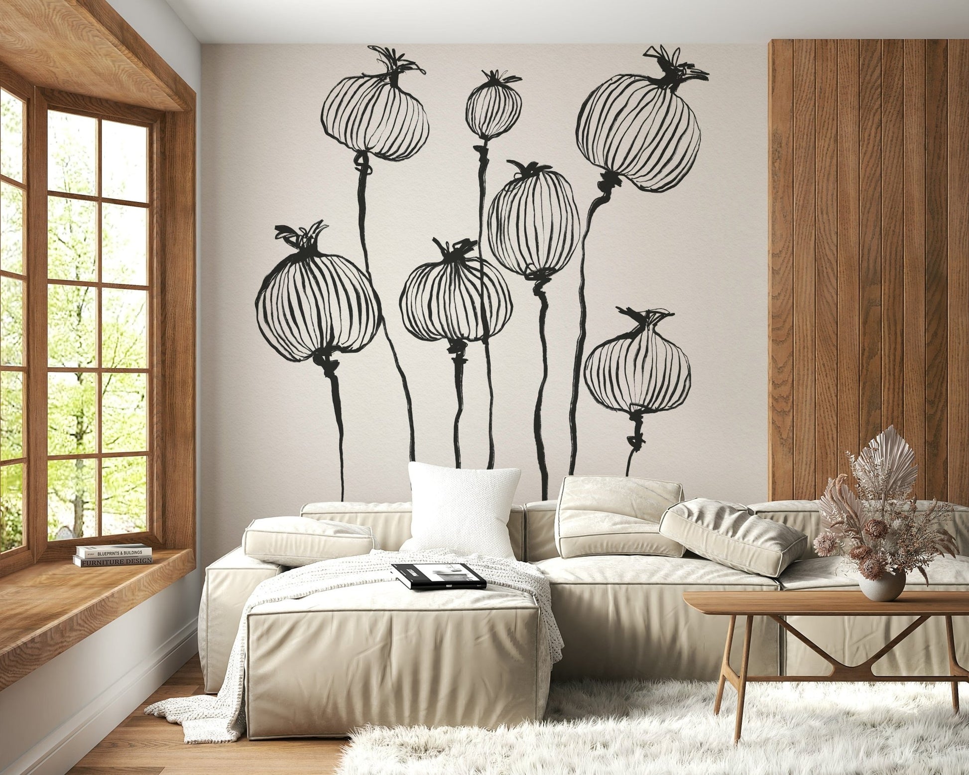Ink Poppy Pods wallpaper mural with black ink pods above a beige leather sectional by a wood window seat
