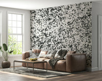 An artistic expressive ink mural on minimalist wallpaper.