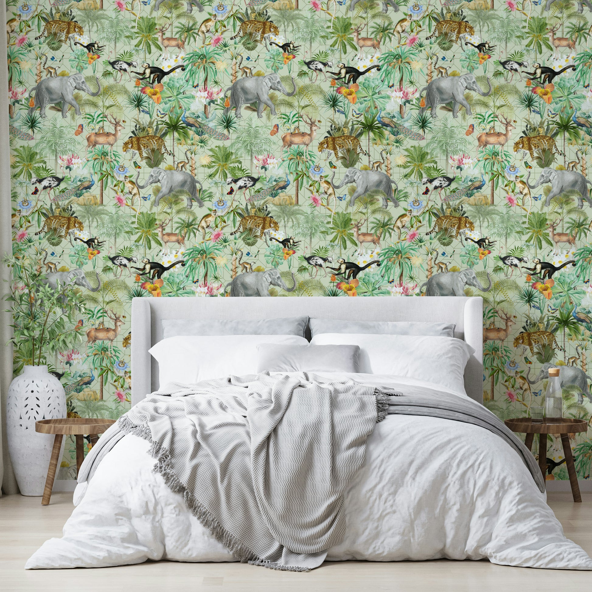 Close-up of tropical plants and exotic flowers in Jungle Opulence wallpaper.

