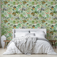 Close-up of tropical plants and exotic flowers in Jungle Opulence wallpaper.

