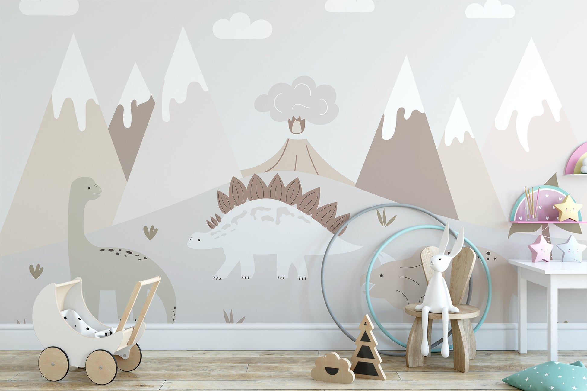 Jurassic Landscape wallpaper mural with dinosaurs and mountains in a nursery with a wooden toy pram and bunny