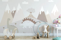 Jurassic Landscape wallpaper mural with dinosaurs and mountains in a nursery with a wooden toy pram and bunny