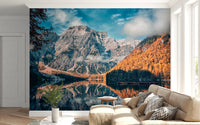 Lake Braies Serenity wallpaper mural of the reflecting lake and autumn larches behind a cream sofa in a bright living room