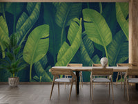 Deep Green Banana leaf wallpaper mural styled along a hallway feature wall near a console in green tones