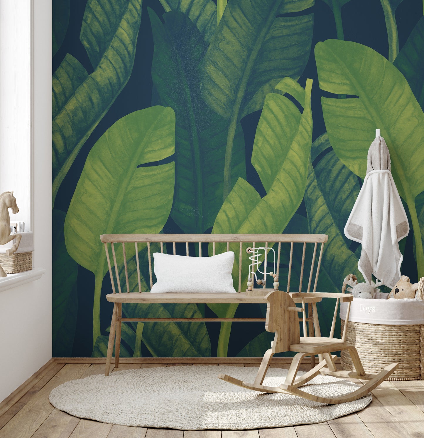 Deep Green Banana leaf wallpaper mural as a feature wall in a home office workspace in green tones