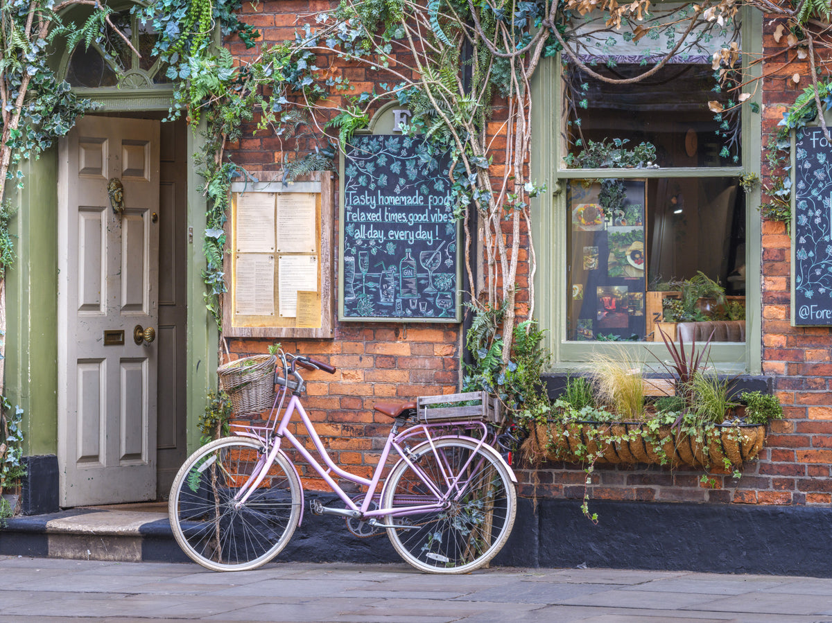 Cozy Cafe with Pink Bicycle Wall Mural in your room