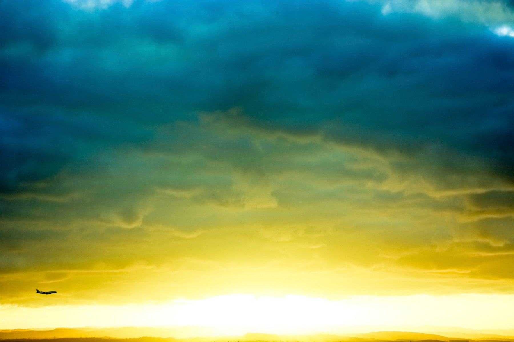 An artistic abstract sunrise mural on minimalist wallpaper.

