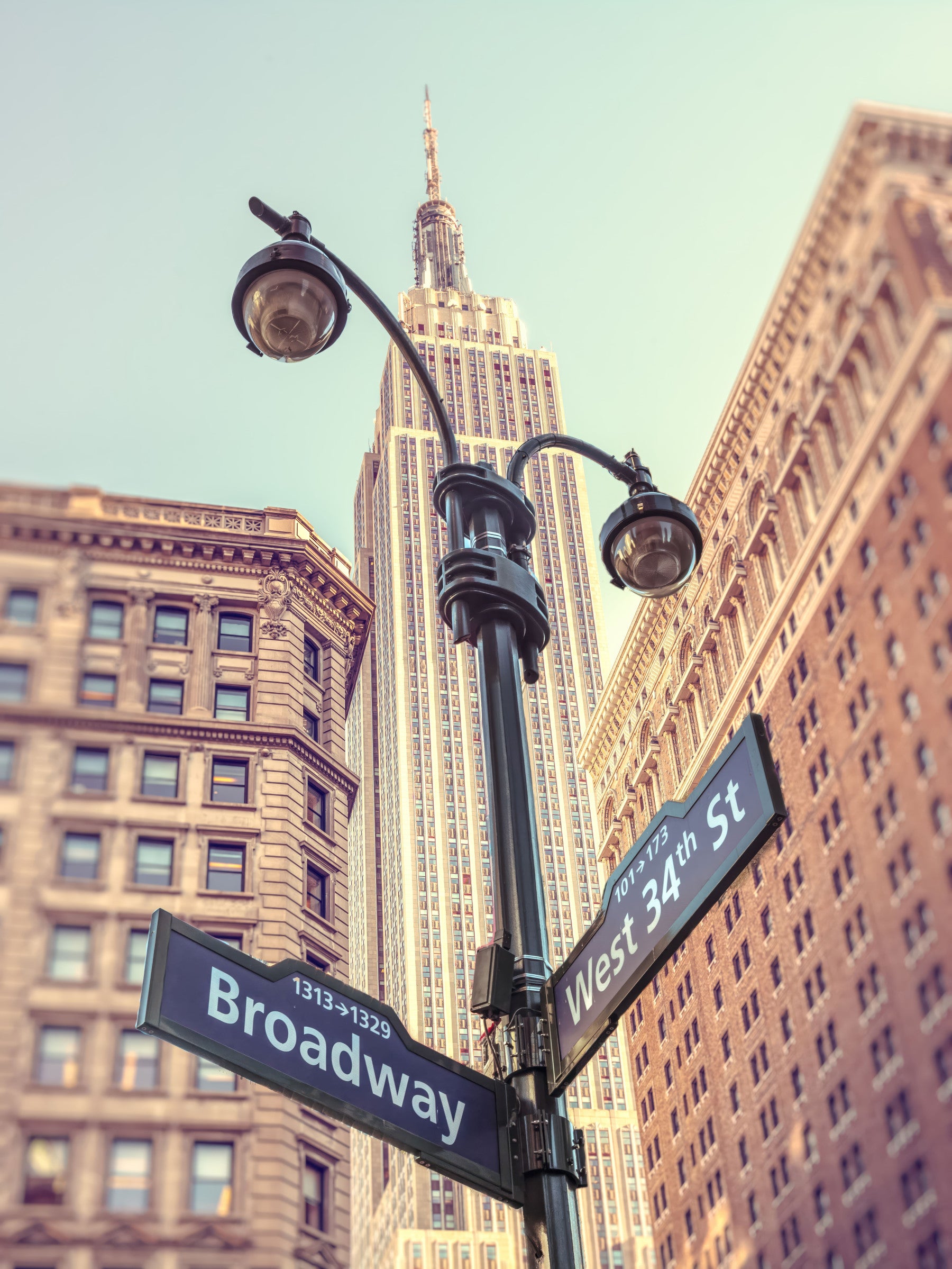 Urban vista Manhattan Majesty print, soaring art-deco wallpaper for walls.