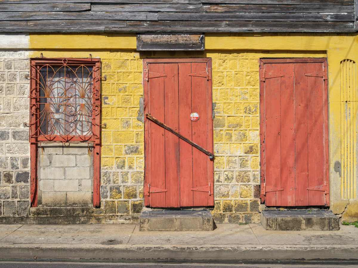 Weathered Brick Wall and Red Doors Wall Mural