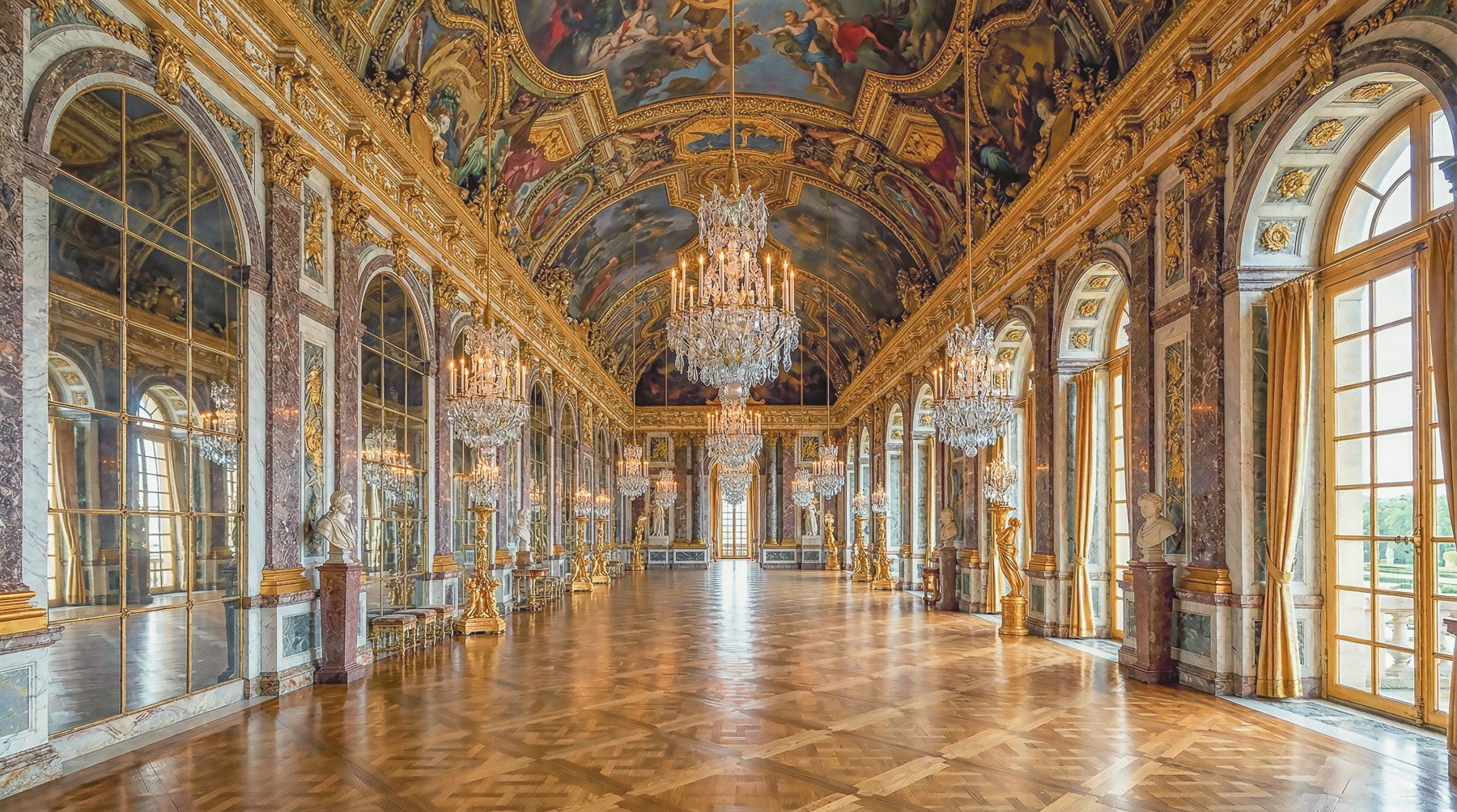 Hall of Mirrors Grandeur wall mural spanning a living room feature surface in gold