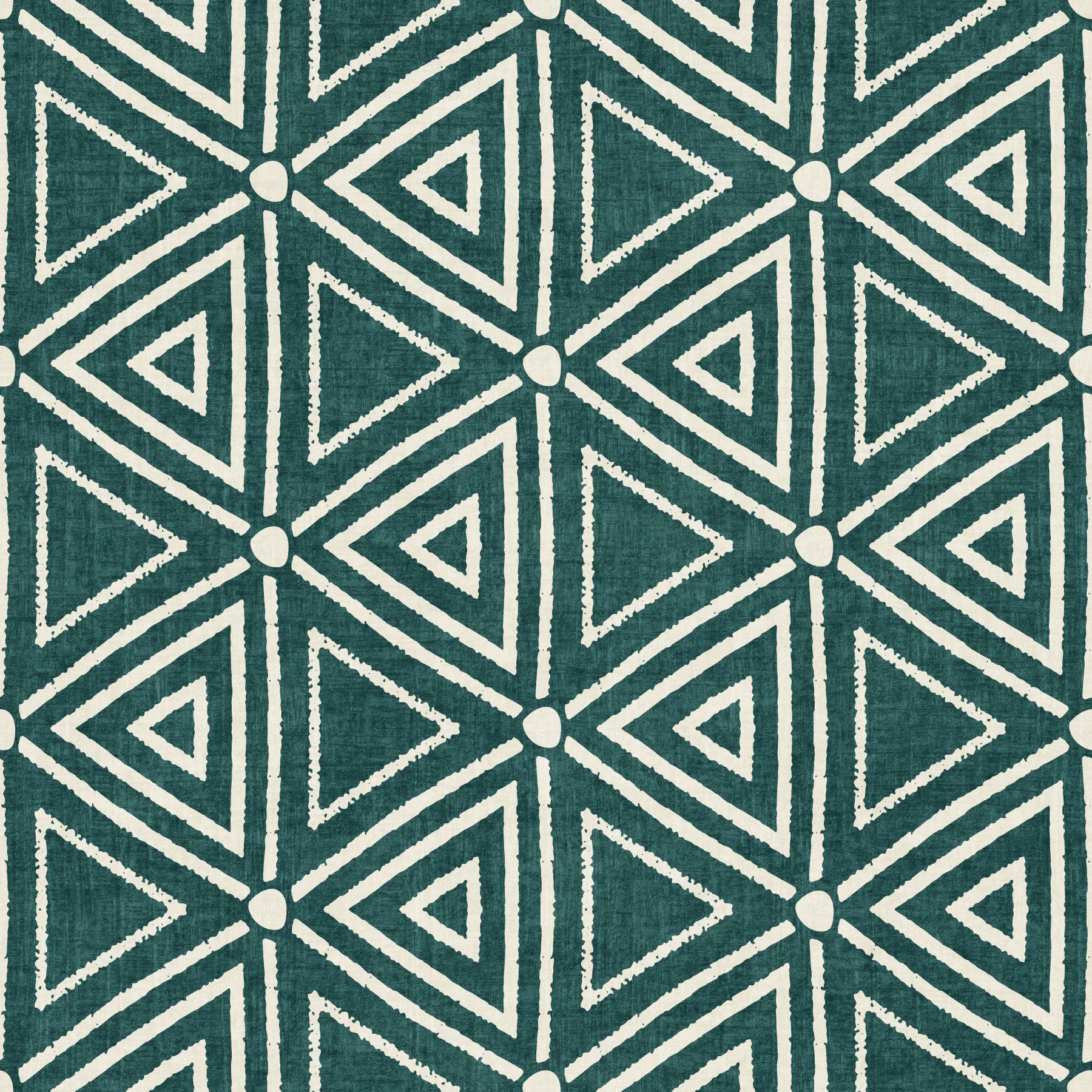 Nested teal triangles wrap a calm living room in Mudcloth Boho wallpaper