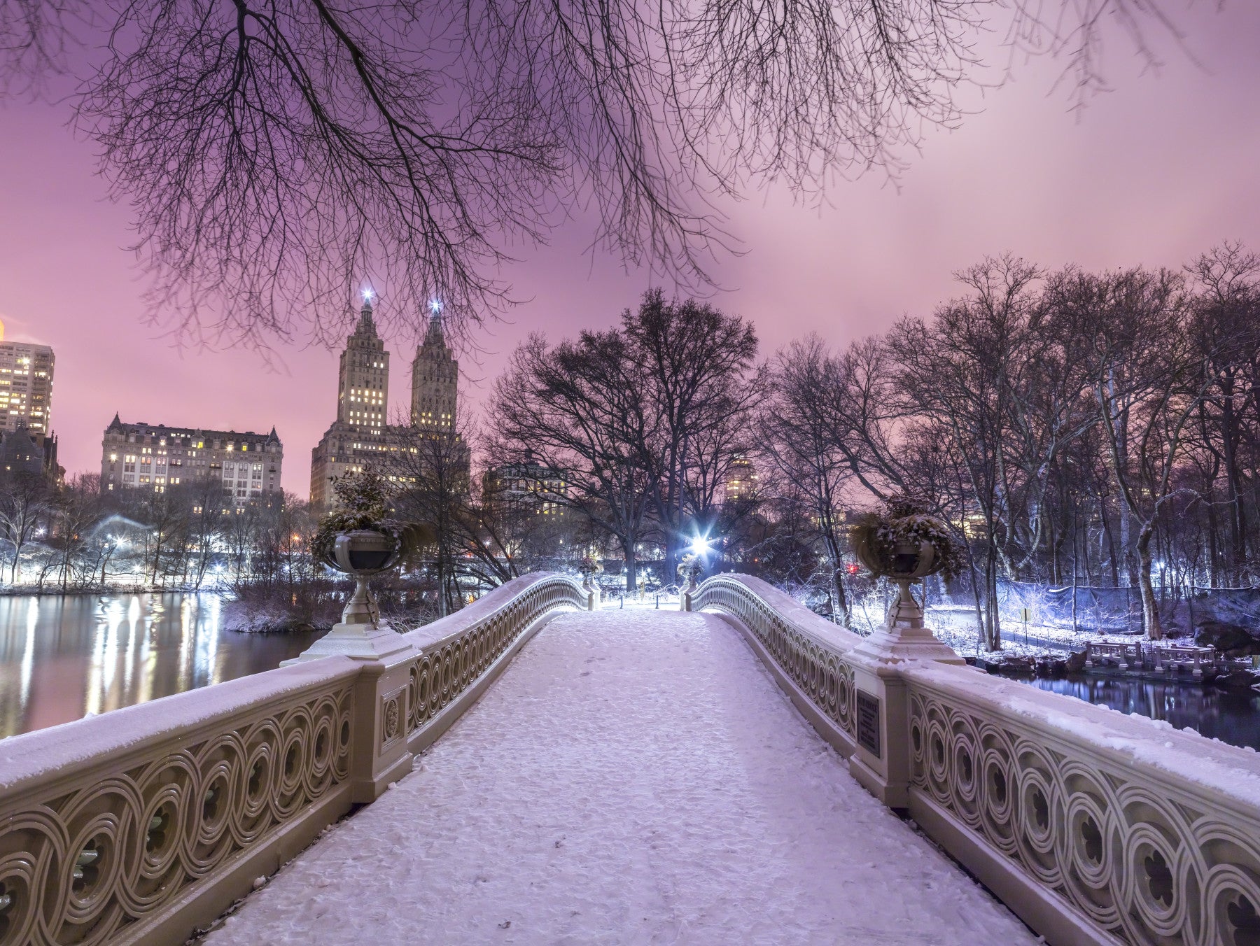 Living room styled with a snowy Bow Bridge Winter wall mural at dusk