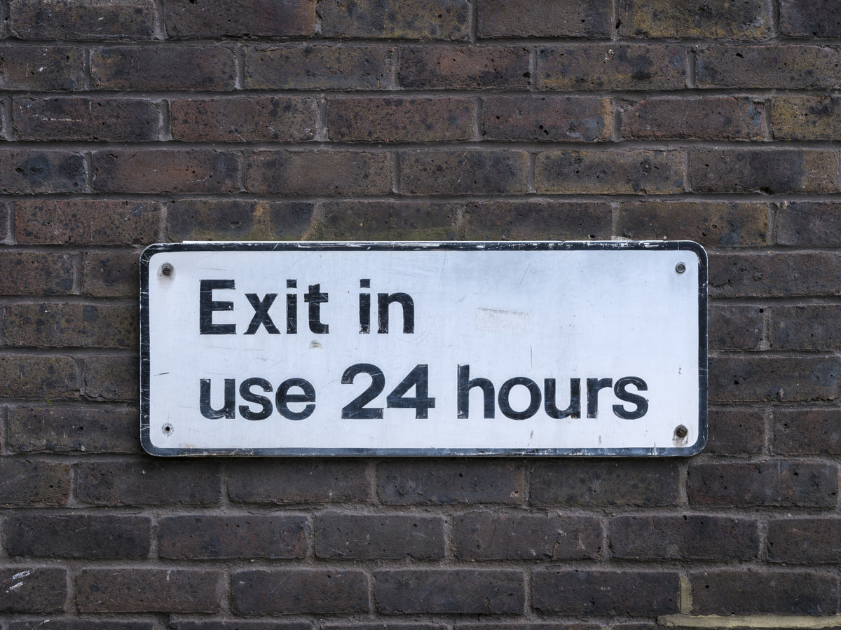 Weathered Exit on Textured Brick Wall Mural in your room — zoomed