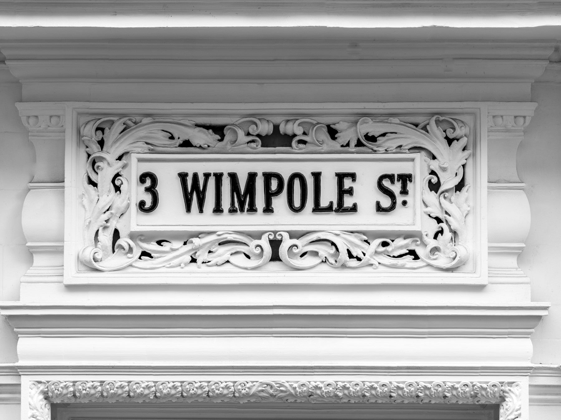 Ornate architectural plaque wall mural with carved stone details
