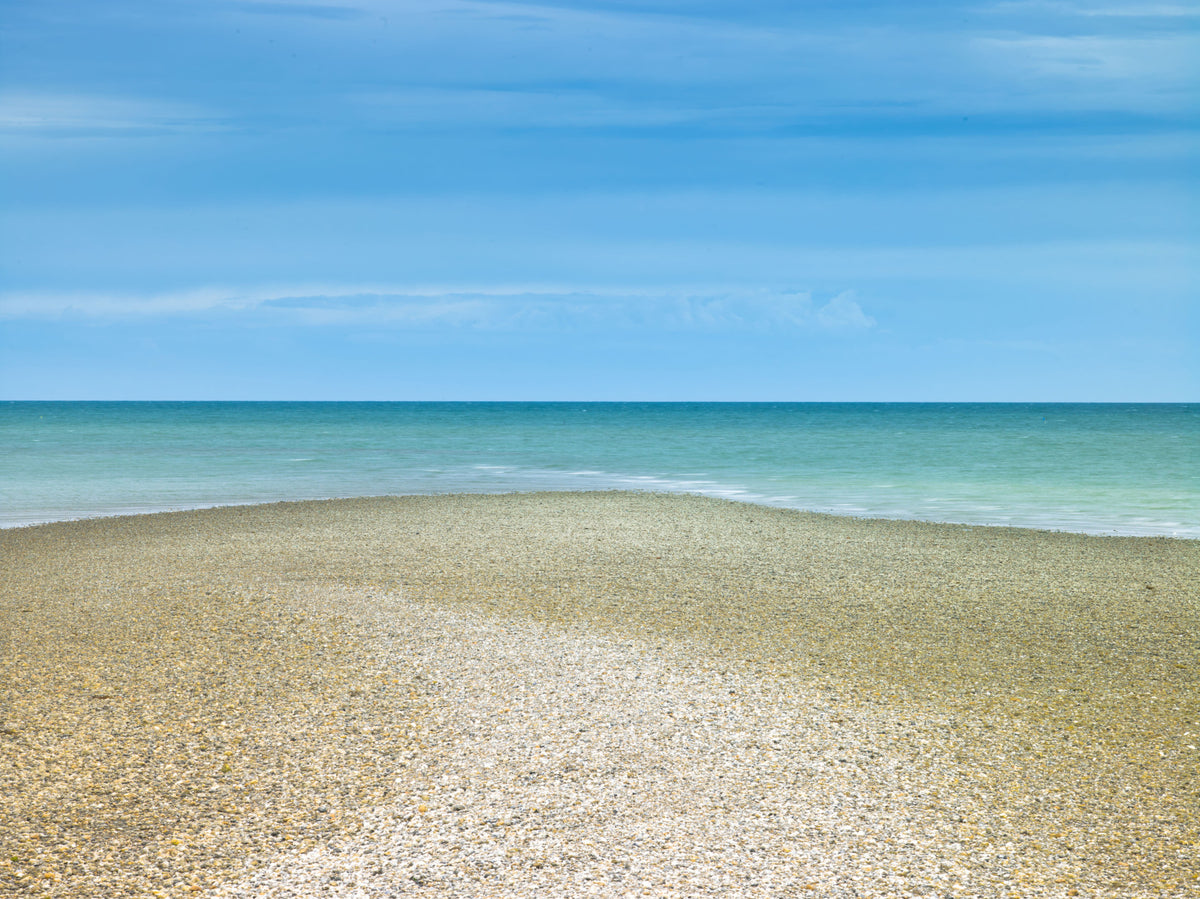 Turquoise Waters Pebble Shoreline Wall Mural in your room